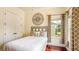 Bedroom with neutral walls, wood floors, and a window at 7411 Excitement Dr, Reunion, FL 34747