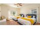Cozy bedroom with two twin beds and stylish contemporary decor at 7411 Excitement Dr, Reunion, FL 34747