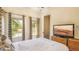 Bedroom with neutral walls, natural light, and wood flooring at 7411 Excitement Dr, Reunion, FL 34747