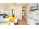 Bedroom featuring modern decor, a mounted television, and doorway at 7411 Excitement Dr, Reunion, FL 34747