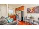 Kitchenette featuring stainless steel appliances, wood cabinets, and a granite counter at 7411 Excitement Dr, Reunion, FL 34747