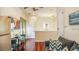 Living room featuring a sofa, dining table, and tv at 7411 Excitement Dr, Reunion, FL 34747