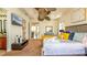 Bright main bedroom featuring white linens, yellow pillows, and tray ceiling at 7411 Excitement Dr, Reunion, FL 34747
