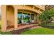 Covered patio with chairs overlooking greenery at 7411 Excitement Dr, Reunion, FL 34747