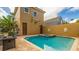 Relaxing pool with a deck, lush landscaping, and a view of the property's architecture at 7411 Excitement Dr, Reunion, FL 34747