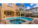 Private pool and spa surrounded by stylish outdoor seating offers an oasis for relaxation and entertainment at 7411 Excitement Dr, Reunion, FL 34747