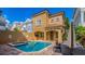 Resort-style backyard featuring a private pool, spa, and outdoor kitchen ideal for entertaining and relaxing at 7411 Excitement Dr, Reunion, FL 34747