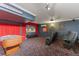 Finished basement with home theater, foosball table, and comfortable seating at 7754 Teascone Blvd, Kissimmee, FL 34747