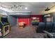 Finished basement featuring a home theater, arcade games, and fun decor at 7754 Teascone Blvd, Kissimmee, FL 34747