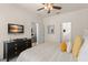 Comfortable bedroom with TV and doorways leading to the Primary bath, a closet, and the living area at 7754 Teascone Blvd, Kissimmee, FL 34747