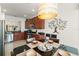 Cozy dining area with a decorative tree hanging on the wall, perfect for Gathering meals at 7754 Teascone Blvd, Kissimmee, FL 34747