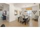 Bright dining room with modern decor, comfortable seating, and elegant light fixture at 7754 Teascone Blvd, Kissimmee, FL 34747