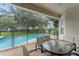 Enjoy outdoor living with this screened-in pool area, perfect for relaxing and entertaining guests at 7754 Teascone Blvd, Kissimmee, FL 34747