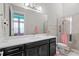 Bathroom with a large mirror, shower, and contemporary design at 7974 Chilton Dr, Orlando, FL 32836