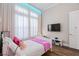 Comfortable bedroom with hardwood floors, and modern furnishings at 7974 Chilton Dr, Orlando, FL 32836