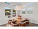 Cozy breakfast nook with a square table and large windows offering a view of the outdoors at 7974 Chilton Dr, Orlando, FL 32836