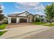 Beautiful home with a brick paved driveway and a two car garage, complimented by manicured landscaping at 7974 Chilton Dr, Orlando, FL 32836