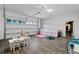 Spacious garage transformed into a playroom with multiple play zones at 7974 Chilton Dr, Orlando, FL 32836
