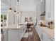 Bright, open kitchen featuring an island, modern appliances, and hardwood floors at 7974 Chilton Dr, Orlando, FL 32836