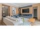 Contemporary living room with modern decor, a large TV, and ample seating at 7974 Chilton Dr, Orlando, FL 32836