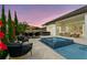 Beautiful pool area featuring outdoor living spaces and dining at sunset at 7974 Chilton Dr, Orlando, FL 32836