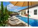 Beautiful pool area with outdoor seating, a dining area, and mature landscaping for privacy at 7974 Chilton Dr, Orlando, FL 32836