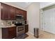 Well-equipped kitchen with stainless steel appliances, granite countertops, and ample wood cabinetry at 9348 Meadow Hunt Way, Winter Garden, FL 34787