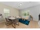 Bright and inviting living room featuring a modern seating arrangement and natural light at 9348 Meadow Hunt Way, Winter Garden, FL 34787
