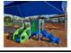 Community playground featuring colorful slides, climbing structures, and a seesaw for outdoor fun at 9348 Meadow Hunt Way, Winter Garden, FL 34787