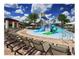 Community splash pad featuring lounge seating, a covered patio, and a variety of water features at 9348 Meadow Hunt Way, Winter Garden, FL 34787