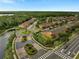 Beautiful aerial view of a residential community with well-maintained landscaping and a pond at 9559 Silver Buttonwood St, Orlando, FL 32832