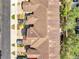 Aerial view of townhome rooftops showcasing the architectural design and community layout at 9559 Silver Buttonwood St, Orlando, FL 32832