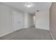Bedroom with neutral carpet, large double door closet, and neutral paint at 9559 Silver Buttonwood St, Orlando, FL 32832