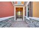 Inviting entrance showcasing brick pavers, stone accents and covered entrance offering an appealing welcome at 9559 Silver Buttonwood St, Orlando, FL 32832
