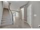 Spacious foyer with a staircase, tile flooring, and open access to the living area, creating a welcoming entry at 9559 Silver Buttonwood St, Orlando, FL 32832