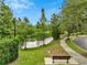 Scenic view of a community green space with a walking path and serene pond, creating a peaceful environment at 9559 Silver Buttonwood St, Orlando, FL 32832