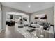 Bright living room with an archway to the dining area, contemporary decor, and stylish furnishings at 9559 Silver Buttonwood St, Orlando, FL 32832