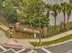 Welcome to Nona Preserve brick signage with wrought iron fencing and landscaping near the waterfront at 9559 Silver Buttonwood St, Orlando, FL 32832
