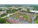 Extensive aerial shot of a condominium complex with lush landscaping and nearby amenities at 101 Grand Plaza Dr # P6, Orange City, FL 32763