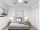 Inviting bedroom with a ceiling fan, shuttered windows, and a well-decorated room with ample natural light at 101 Grand Plaza Dr # P6, Orange City, FL 32763