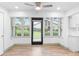 Bright dining area features large windows, ceiling fan, and access to outdoor living space at 101 Grand Plaza Dr # P6, Orange City, FL 32763