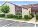 Exterior view of P-6 unit showcasing its neatly manicured landscaping and convenient parking at 101 Grand Plaza Dr # P6, Orange City, FL 32763