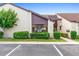 Exterior view of P-6 unit featuring clean landscaping and adjacent parking spaces at 101 Grand Plaza Dr # P6, Orange City, FL 32763