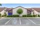 Exterior view of condominiums showing well-maintained landscaping and convenient parking area at 101 Grand Plaza Dr # P6, Orange City, FL 32763