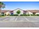 Exterior view of the condominiums featuring neat landscaping and ample parking at 101 Grand Plaza Dr # P6, Orange City, FL 32763