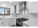 A modern kitchen featuring white cabinetry, stainless steel appliances, and a beautiful marble backsplash at 101 Grand Plaza Dr # P6, Orange City, FL 32763