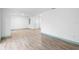 Bright living room featuring wood floors and a fresh, clean aesthetic with natural light at 101 Grand Plaza Dr # P6, Orange City, FL 32763