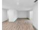 Spacious living room with wood-look flooring, offering a clean and bright atmosphere at 101 Grand Plaza Dr # P6, Orange City, FL 32763