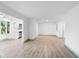 Open floor plan with light wood floors connects the living area to a modern kitchen at 101 Grand Plaza Dr # P6, Orange City, FL 32763