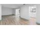 A spacious living area with light wood floors, connecting seamlessly to other rooms at 101 Grand Plaza Dr # P6, Orange City, FL 32763